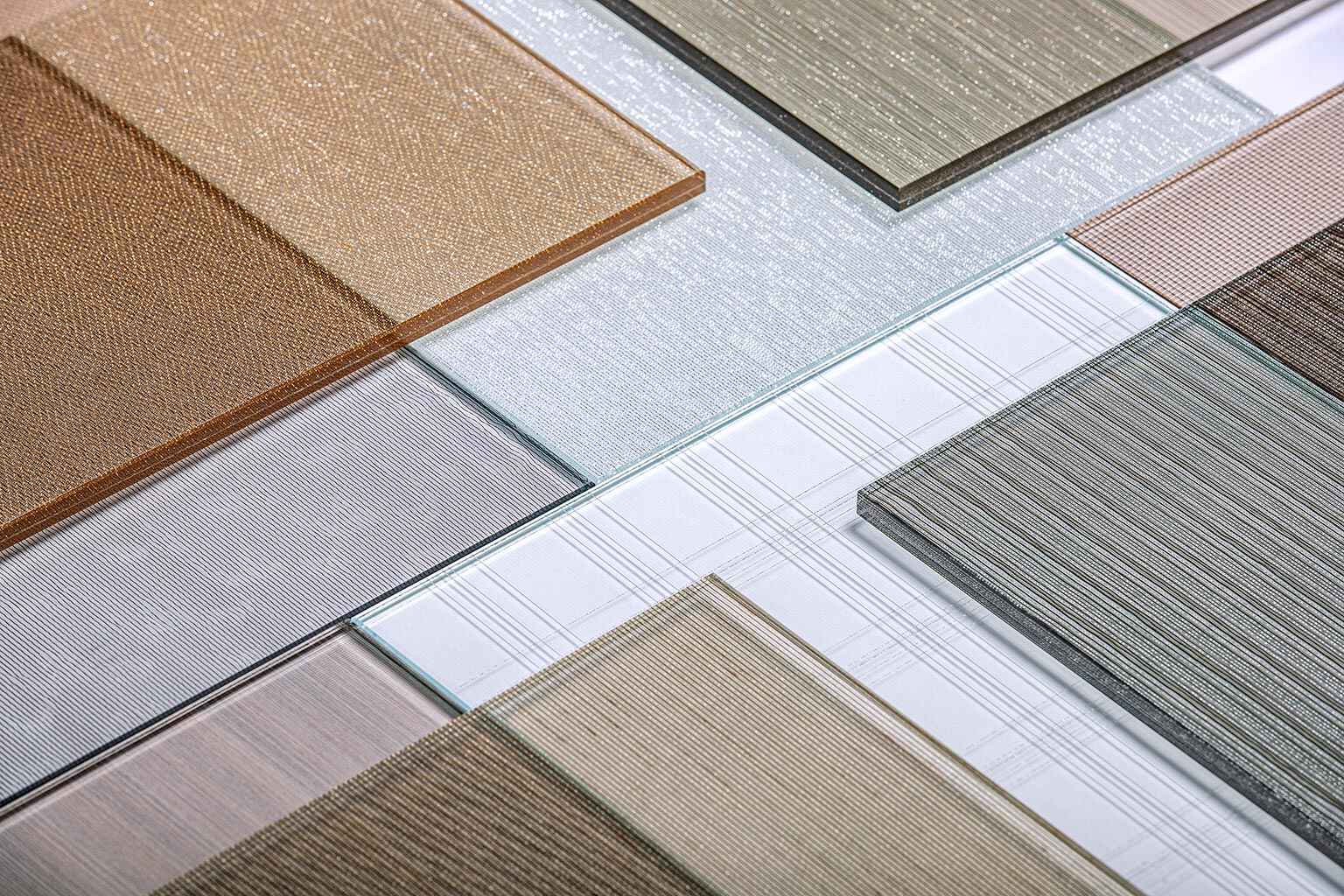 fabric mesh laminated glass, fabric mesh lamination services, decorative fabric mesh lamination, fabric mesh lamination for glass, fabric mesh laminated glass solutions